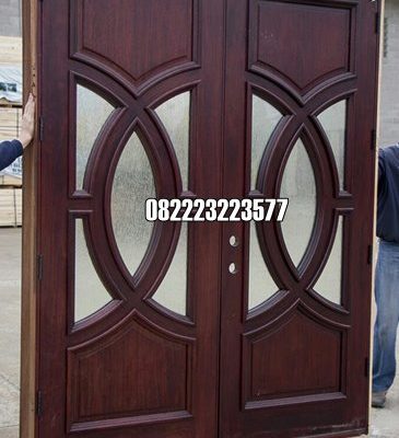Model Pintu Rumah Utama Motif Kaca Kayu Jati Kupu Tarung